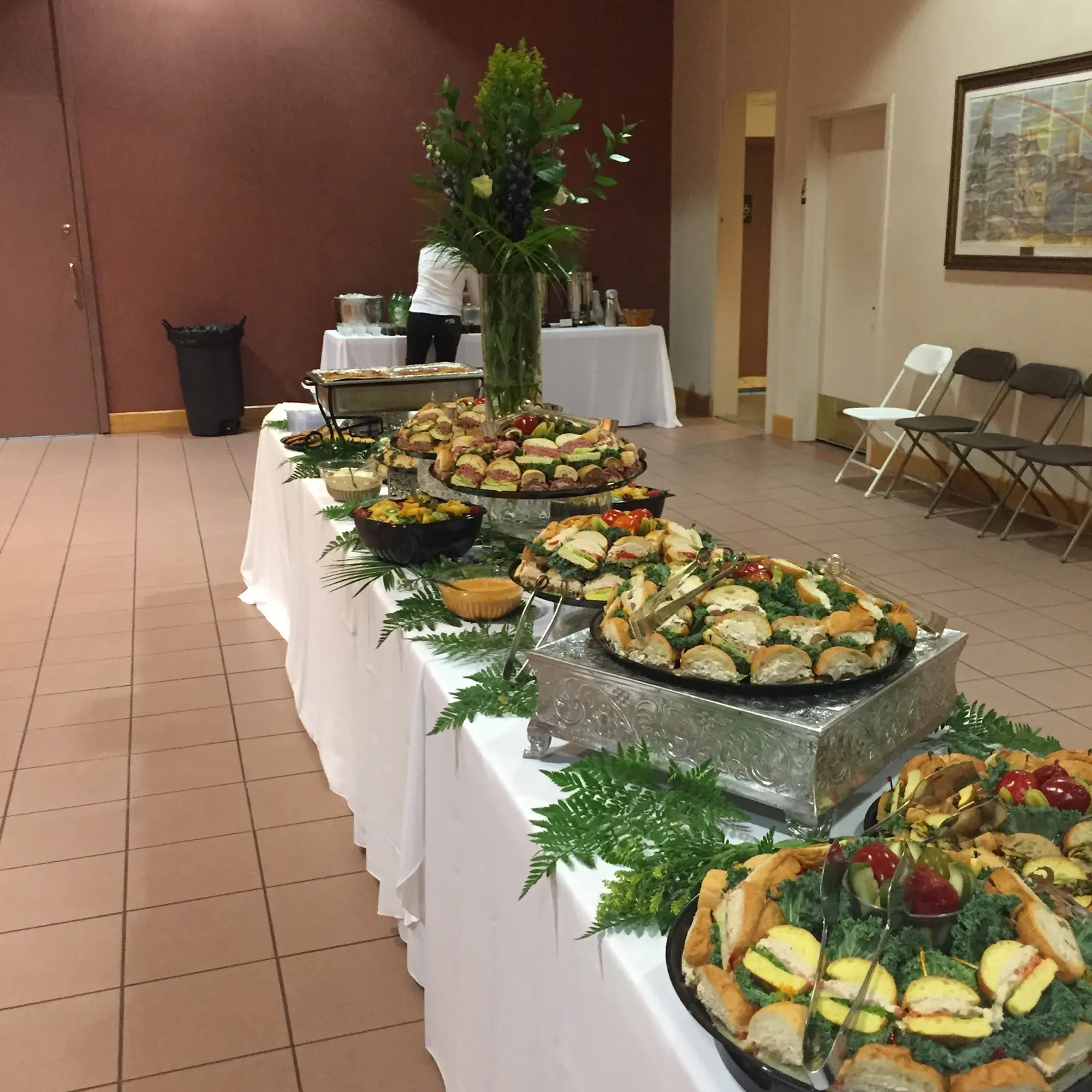 A long table of Romanelli's sandwich and food platters