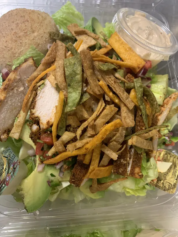 A stacked sandwich with fries